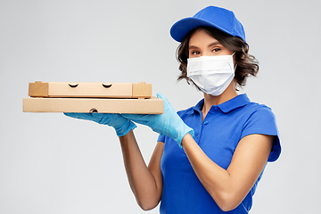 Image showing delivery woman in face mask with pizza boxes