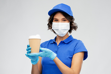Image showing saleswoman in face mask with takeaway coffee cup