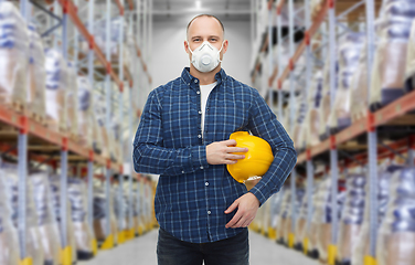 Image showing male worker wearing respirator mask at warehouse