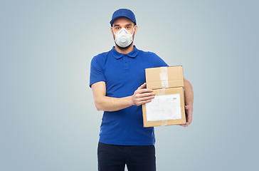 Image showing delivery man with parcel box in respirator