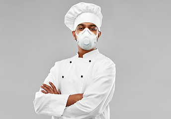 Image showing male chef in respirator at restaurant kitchen