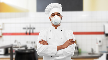 Image showing male chef in respirator at restaurant kitchen