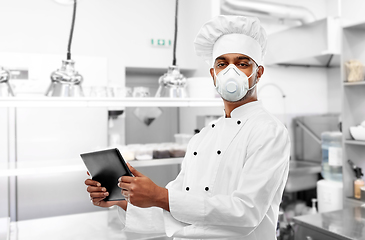 Image showing chef in respirator with tablet pc at kitchen