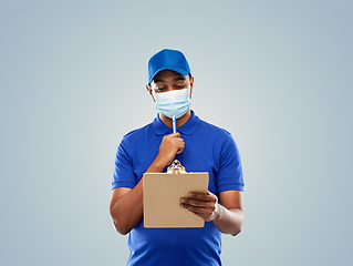 Image showing delivery man in face mask with clipboard