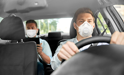 Image showing taxi driver in mask driving car with passenger