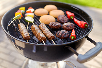 Image showing barbecue kebab meat and vegetables on grill