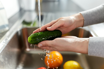 Image showing woman washing fruits and vegetables in kitchen