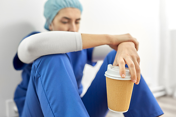 Image showing sad doctor or nurse with cup of takeaway coffee