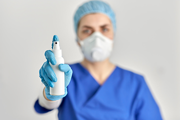 Image showing close up of doctor or nurse with hand sanitizer