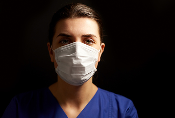 Image showing female doctor or nurse in medical face mask