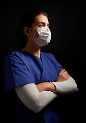 Image showing female doctor or nurse in medical face mask