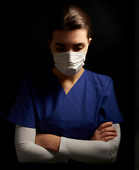 Image showing female doctor or nurse in medical face mask