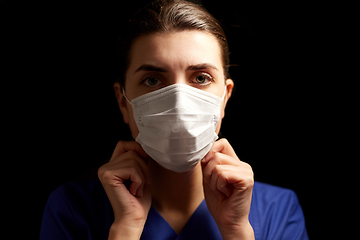 Image showing female doctor or nurse in medical face mask