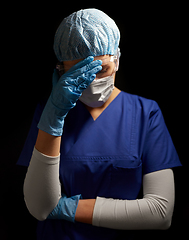 Image showing sad doctor or nurse in goggles and face mask