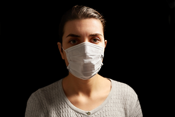 Image showing sick young woman in protective medical face mask