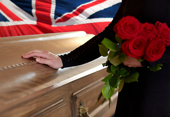 Image showing woman with red roses and coffin over english flag