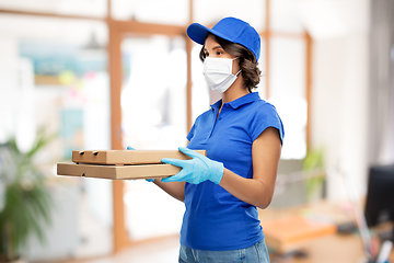 Image showing delivery woman in mask with pizza boxes at office