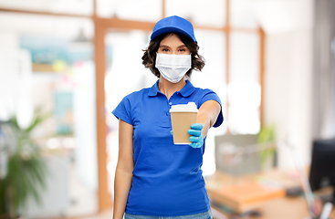 Image showing saleswoman in face mask with coffee cup at office