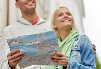 Image showing close up of happy couple with map exploring city