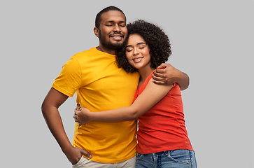 Image showing happy african american couple hugging