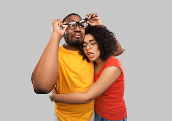 Image showing happy african american couple in glasses hugging