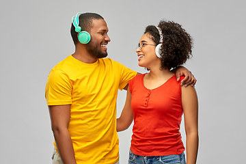 Image showing happy african american couple with headphones