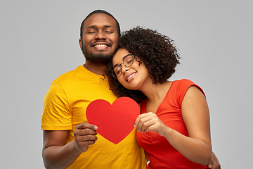 Image showing happy african american couple holding red heart