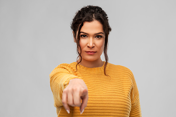 Image showing young woman pointing finger to camera