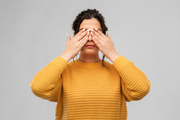 Image showing woman with eyes closed by hands