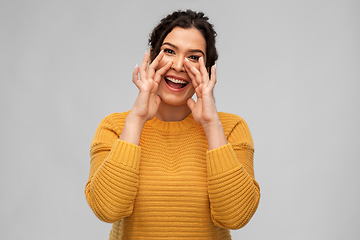 Image showing happy woman with pierced nose calling