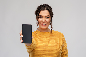 Image showing happy woman showing smartphone