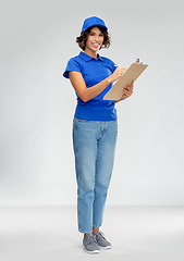 Image showing happy smiling delivery woman with clipboard