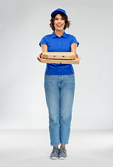 Image showing happy smiling delivery woman with pizza boxes
