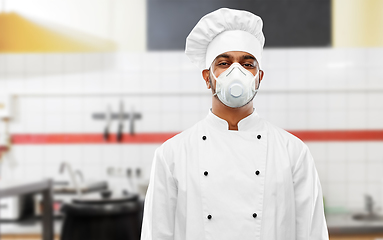 Image showing male chef in respirator at restaurant kitchen