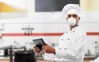 Image showing chef in respirator with tablet pc at kitchen