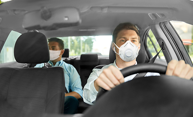 Image showing taxi driver in mask driving car with passenger