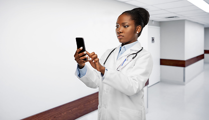 Image showing african american female doctor with smartphone