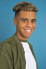 Image showing African-american man\'s portrait isolated on blue studio background