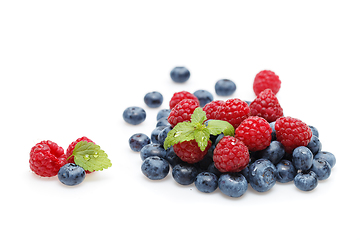 Image showing blueberry and raspberry berries isolated on white background