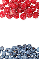 Image showing blueberry and raspberry berries isolated on white background