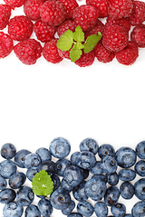 Image showing blueberry and raspberry berries isolated on white background