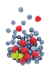 Image showing blueberry and raspberry berries isolated on white background