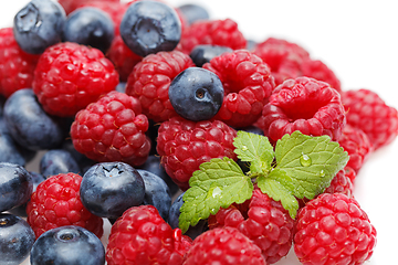 Image showing blueberry and raspberry berries isolated on white background