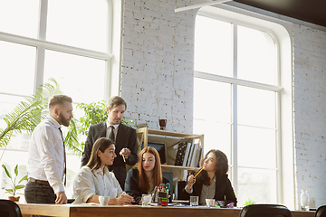 Image showing Group of young business professionals having a meeting, creative office