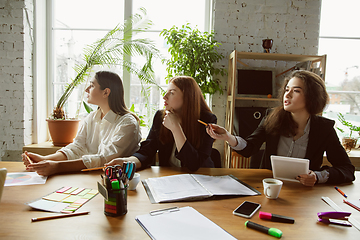 Image showing Group of young business professionals having a meeting, creative office