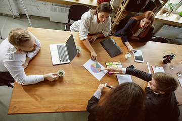 Image showing Group of young business professionals having a meeting, creative office