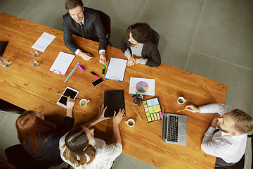 Image showing Group of young business professionals having a meeting, creative office