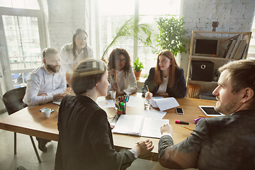 Image showing Group of young business professionals having a meeting, creative office