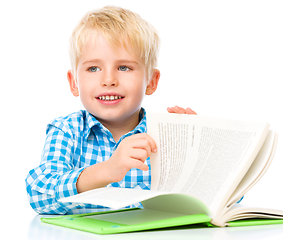 Image showing Little child play with book