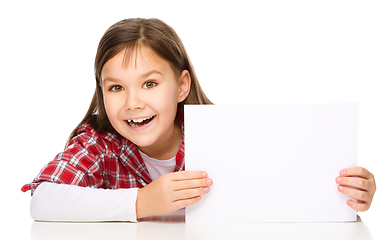 Image showing Little girl is looking from out blank board